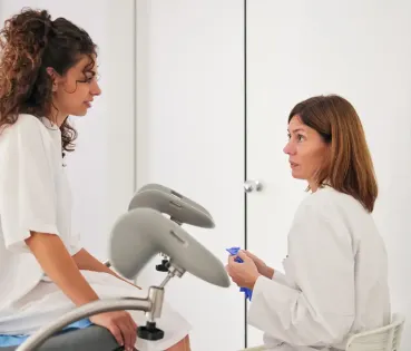 Doctor and patient talking in a medical office.