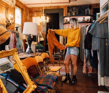 Woman browsing in a 'vintage' shop