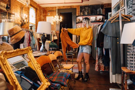 Woman browsing in a 'vintage' shop