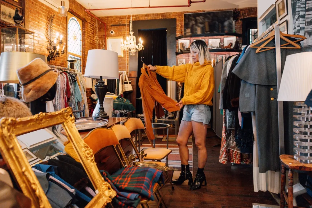 Woman browsing in a 'vintage' shop